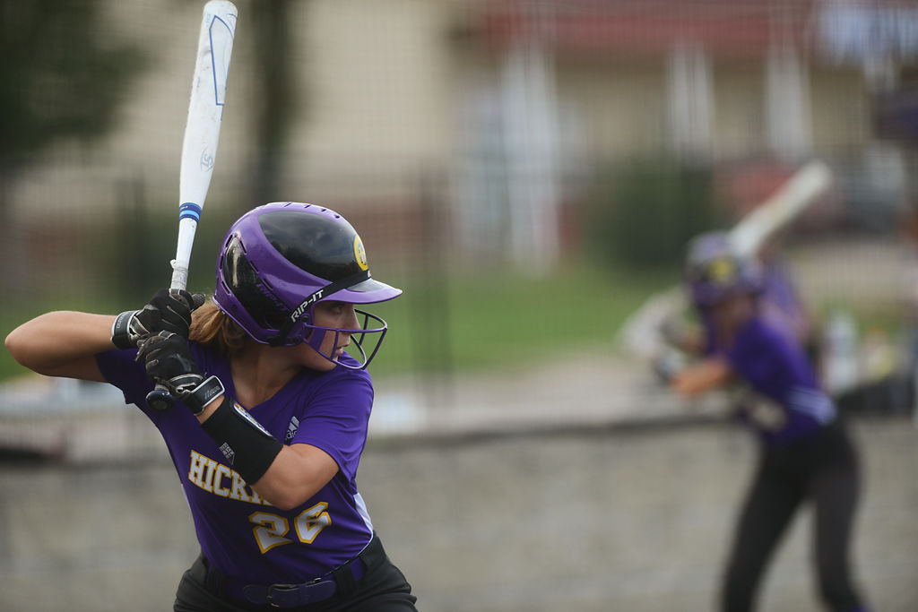 Loren Gilland watches the batter during warmups before coming to the plate